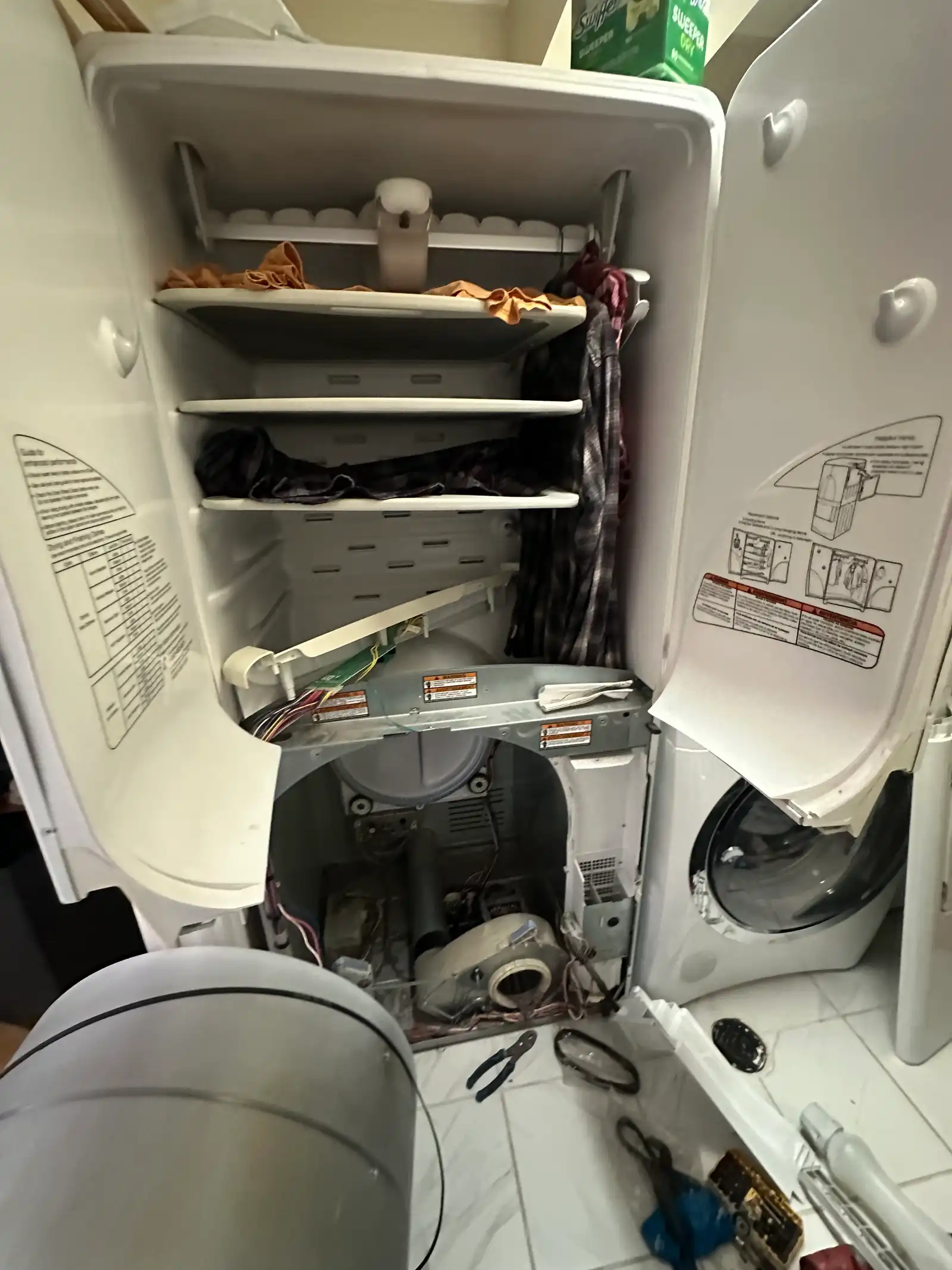 Dryer drum removed during repair in an Ottawa laundry room