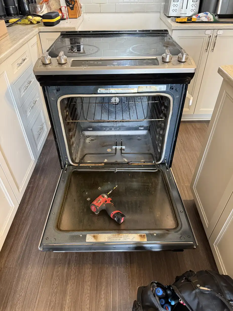 Electric oven repair tools during diagnosis in an Ottawa kitchen